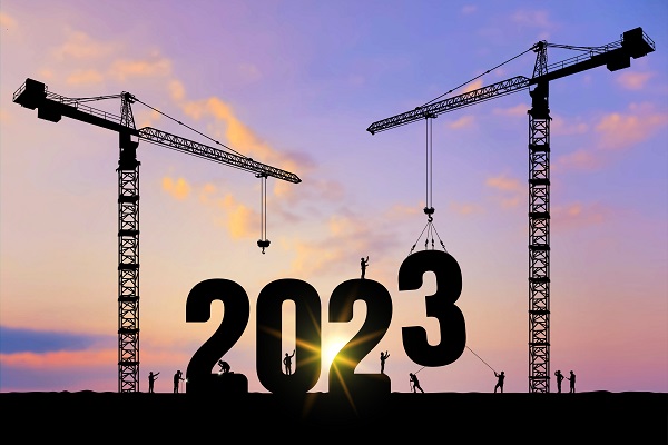 Vector silhouette of construction worker with crane and sky for preparation of 2023.